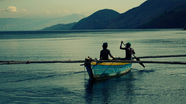 Serene Canoe Journey On Lake In Burundi Wallpaper