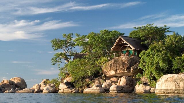 Serene Lake Malawi Hut Amidst Nature Wallpaper