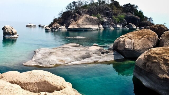 Serene Landscape Of Lake Malawi With Boulders And Clear Water