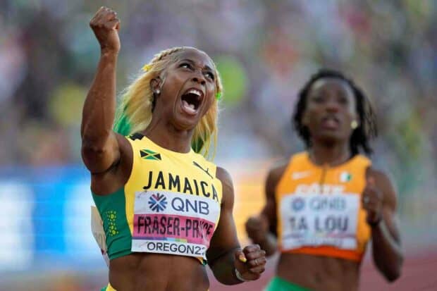 Shelly Ann Fraser Pryce shows intense emotion after winning a race in a stadium, HD Desktop Wallpaper