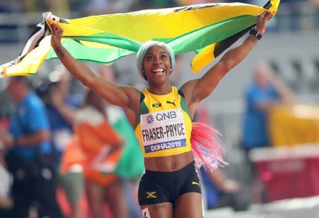 Shelly Ann Fraser Pryce is celebrating with the Jamaican flag after a race victory, HD Desktop Wallpaper
