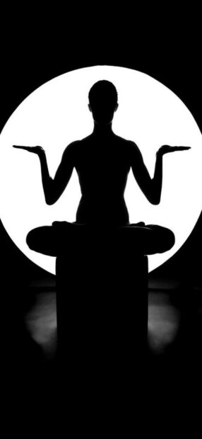 A silhouette meditates in a yoga pose with a bright circular light behind, HD Phone Wallpaper