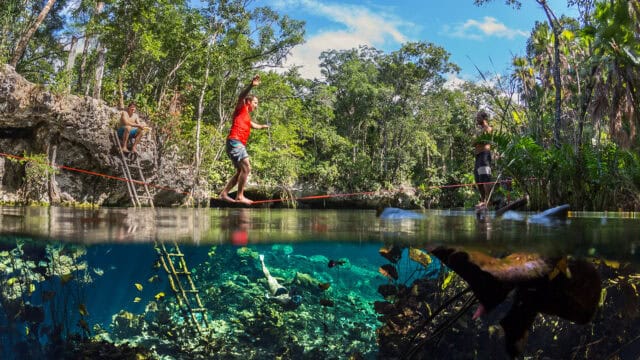 Slacklining over clear water in tropical forest vibrant nature slacklining wallpapers
