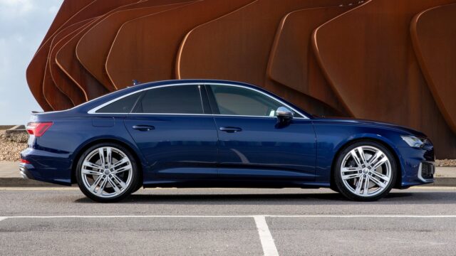 Sleek Blue Audi S6 Sedan Side View With Modern Urban Background For Wallpapers