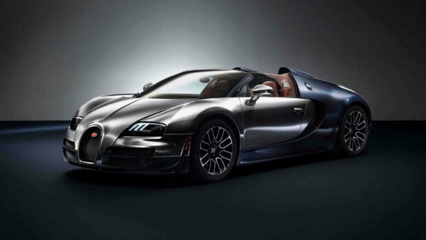 A sleek Bugatti Veyron is shown with its doors open in a studio setting under soft lighting, 2K Desktop Wallpaper