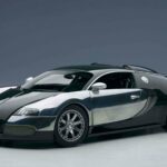 A sleek Bugatti Veyron is parked in a studio with sharp lighting highlighting its design, 2K Desktop Wallpaper