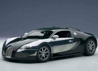 A sleek Bugatti Veyron is parked in a studio with sharp lighting highlighting its design, 2K Desktop Wallpaper