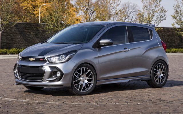 Sleek Chevrolet Spark In Urban Setting For Wallpapers
