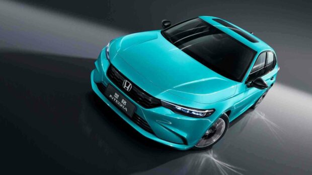A turquoise Honda Integra is displayed from a front angle in a modern studio setting, highlighting its design and headlights, HD Desktop Wallpaper
