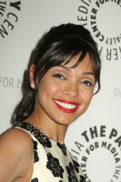 Smiling Woman At Media Event Ideal For Aisha Taylor Wallpapers