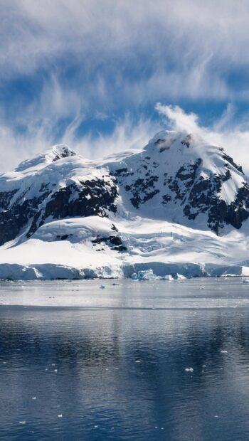 The Arctic mountains are covered with snow and ice reflecting on the calm water surface, 2K Mobile Wallpaper
