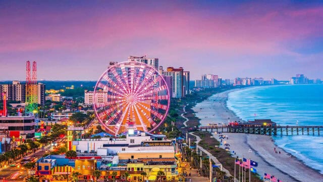South Carolina Beachfront Skyline with Ferris Wheel and Colorful City Lights Wallpaper