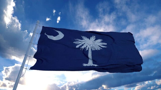 South Carolina Flag Waving Against a Dramatic Sky South Carolina Wallpapers