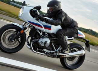 A rider in full gear drives a Bmw R Nine T motorcycle along a countryside road, 4K Desktop Wallpaper