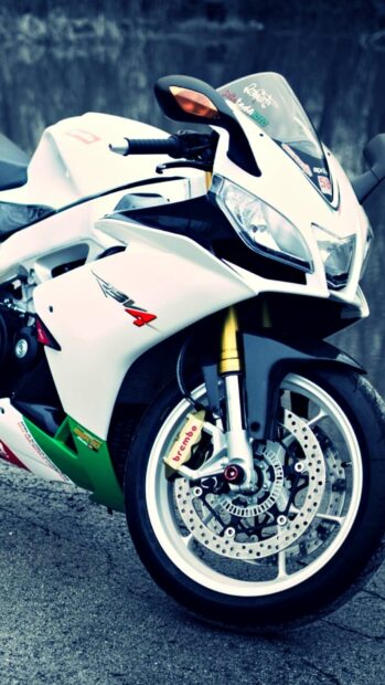 A close up view of a sporty Aprilia motorcycle highlighting the front wheel and fairing design, HD Phone Wallpaper
