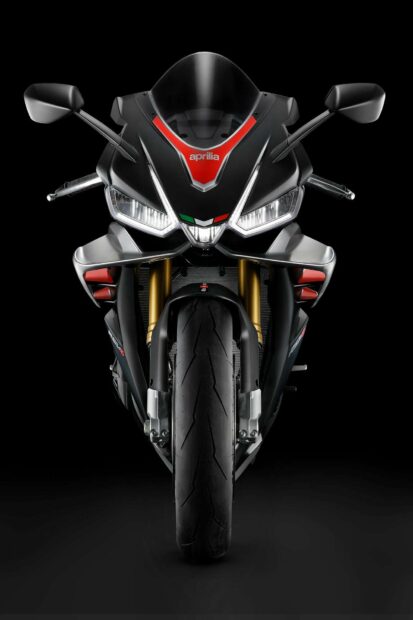 The Aprilia motorcycle showcases a sleek front design with detailed headlights and sporty elements, HD Mobile Wallpaper