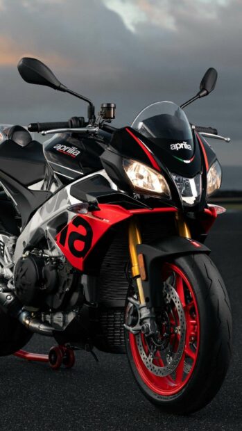 A detailed Aprilia motorcycle shines with red and black design, HD Phone Wallpaper