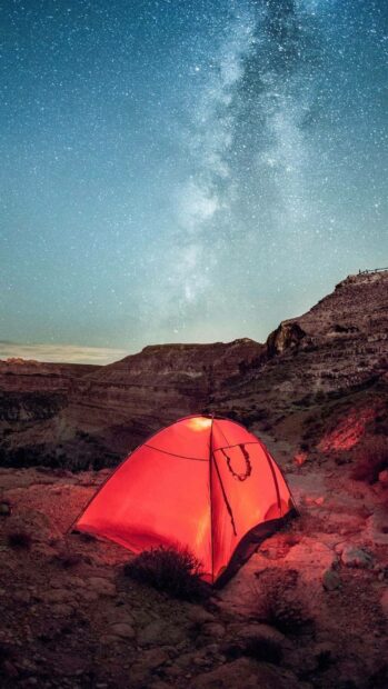 A red tent glows under a star filled sky in the Algeria landscape, HD Phone Wallpaper