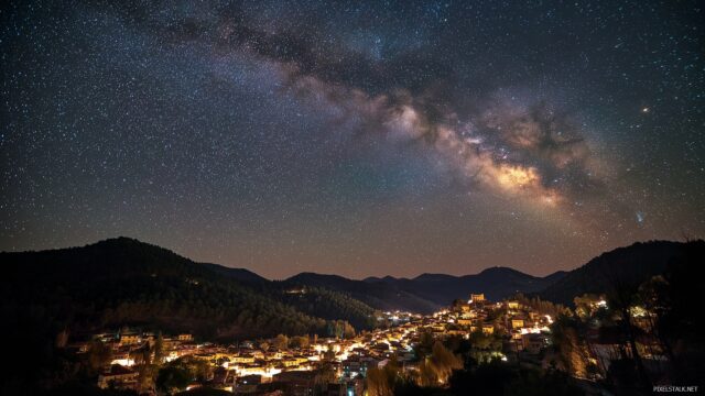 Starry Night High Resolution Desktop Background, A Dramatic Night Sky Swirling With Galaxies And Stars Over A Peaceful Town