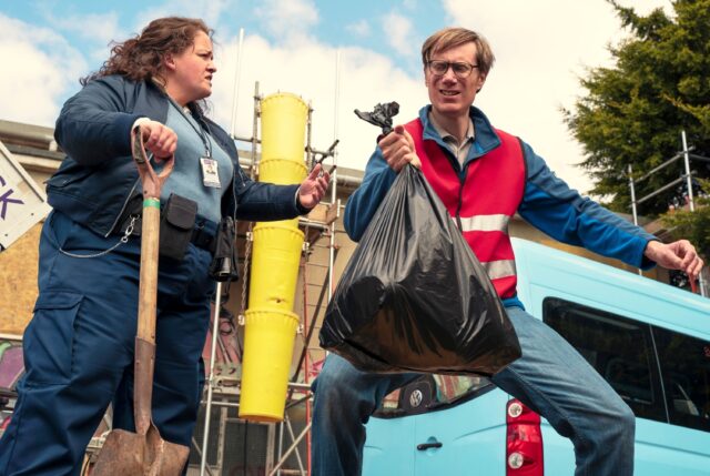 Stephen Merchant Wallpapers featuring outdoor scene with cleaning workers and garbage bag