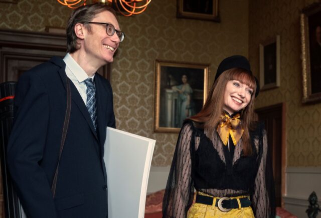 Stephen Merchant and Female Co star Smiling in Vintage Style Room Stephen Merchant Wallpapers