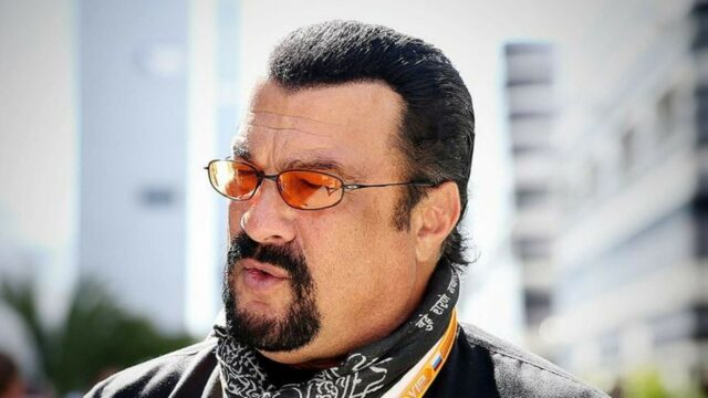 Steven Seagal Close Up Portrait with Orange Sunglasses and Urban Background Wallpapers
