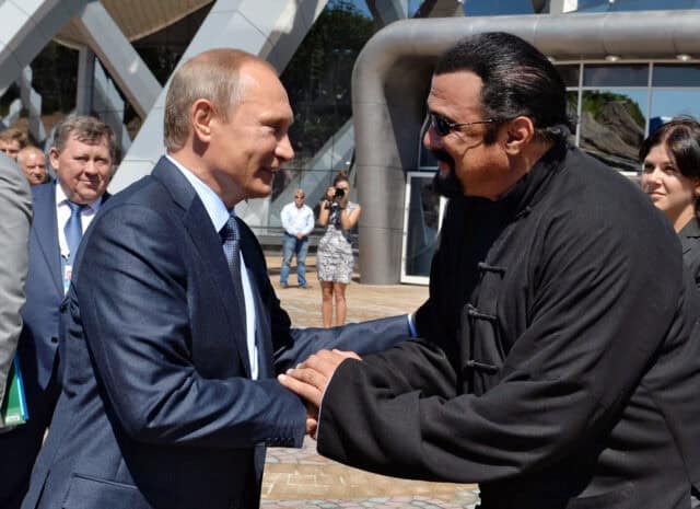 Steven Seagal Meeting a Prominent Figure in Black Traditional Outfit Steven Seagal Wallpapers
