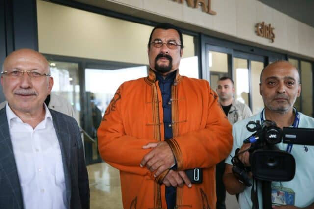 Steven Seagal in Traditional Orange Jacket with Media Team Steven Seagal Wallpapers