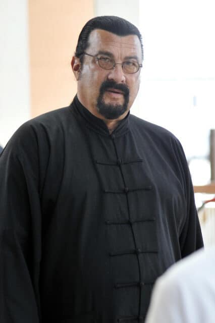 Steven Seagal in traditional black martial arts robe close up portrait wallpaper