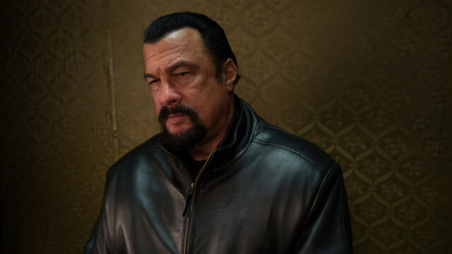 Steven Seagal intense look in black leather jacket wallpaper for fans