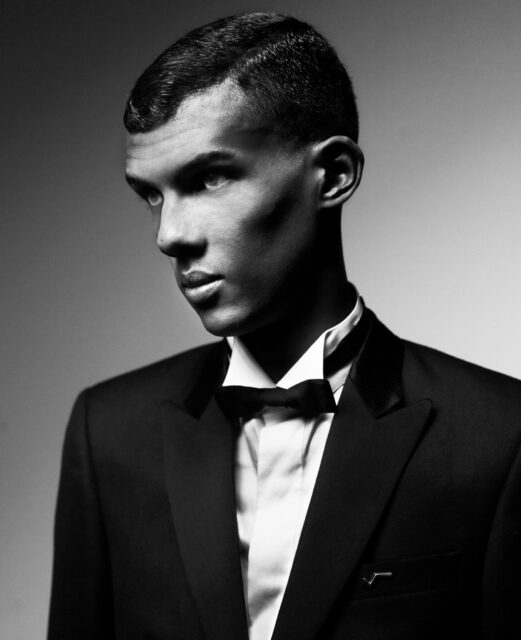Stromae Black and White Portrait Elegant Tuxedo Wallpaper for Stylish Backgrounds