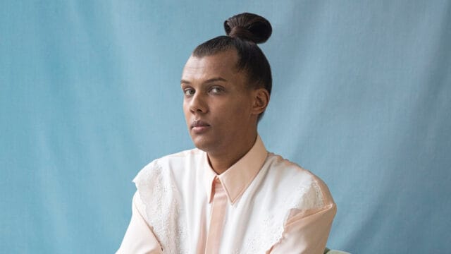 Stromae Portrait Wallpaper Classic Style Blue Background