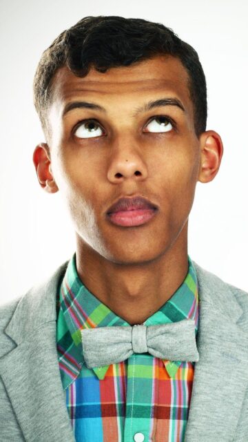 Stromae Wallpapers Close Up Portrait of Man Wearing Colorful Shirt and Bow Tie