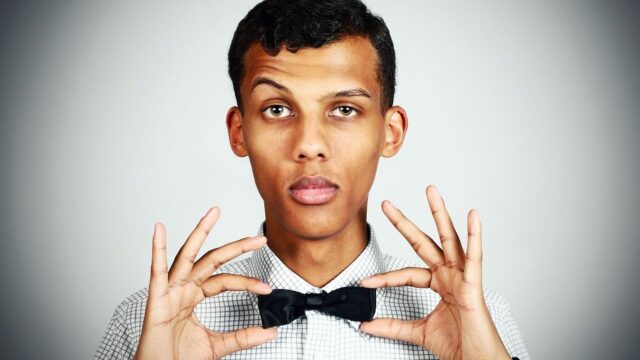 Stromae close up portrait with black bow tie stylish wallpaper