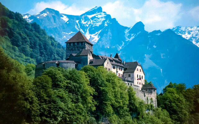 Stunning Alpine View Of Vaduz Castle Surrounded By Lush Greenery
