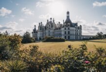 Stunning Chateau De Chambord Wallpaper With Historic Castle And Scenic Garden View