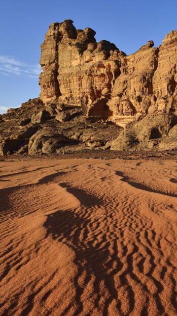 The image shows detailed desert rock formations under a clear blue sky in Algeria, HD Phone Wallpaper