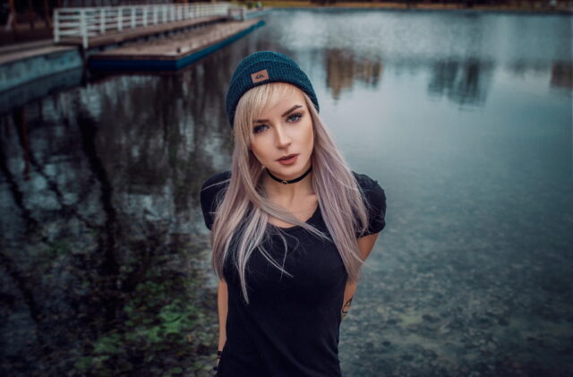 Stylish Woman Wearing Black Choker by the Water Perfect Choker Wallpapers Background