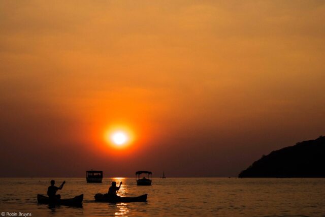 Sunset Serenity At Lake Malawi With Canoe Silhouettes