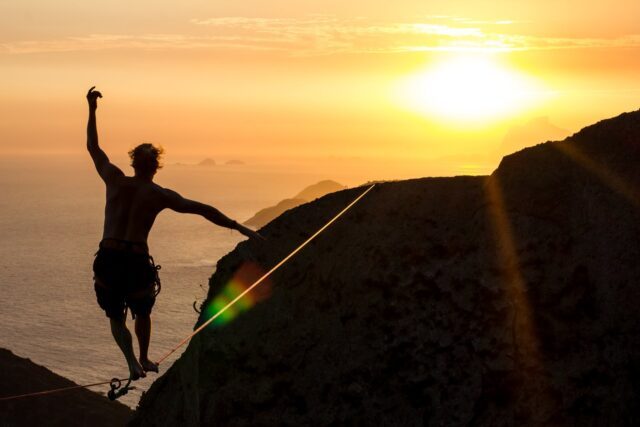 Sunset Slacklining Adventure Above Cliffs with Ocean View Slacklining Wallpapers