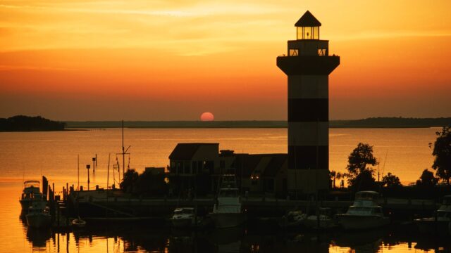 Sunset over South Carolina lighthouse and marina scenic wallpapers