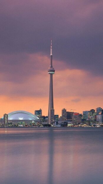 The CN Tower stands tall against a colorful sunset over Toronto's skyline in Canada, HD Phone Wallpaper