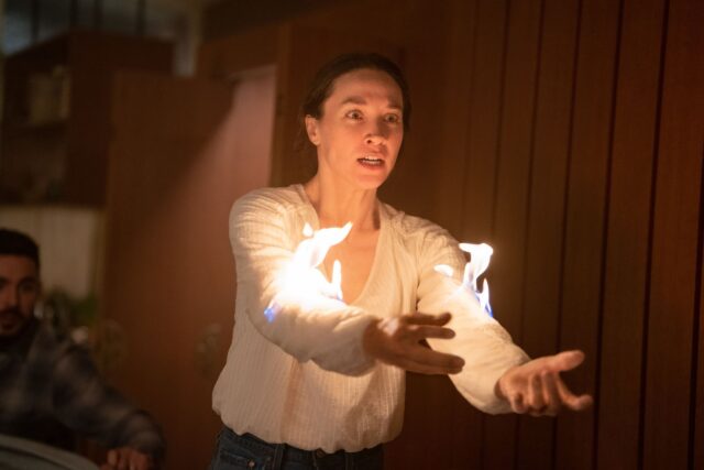 Sydney Lemmon Captivating Fire Scene Wallpaper