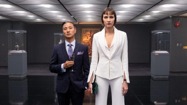 Sydney Lemmon Striking White Suit In Art Gallery Scene