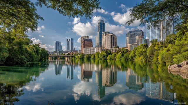 Texas High Quality Background, The Iconic Skyline Of Austin, Texas Reflecting In The Water, Surrounded By Lush Greenery