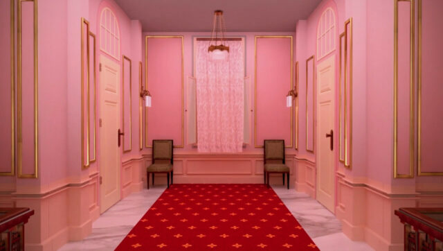 The Grand Budapest Hotel Elegant Pink Hallway with Red Carpet and Classic Chairs Wallpaper