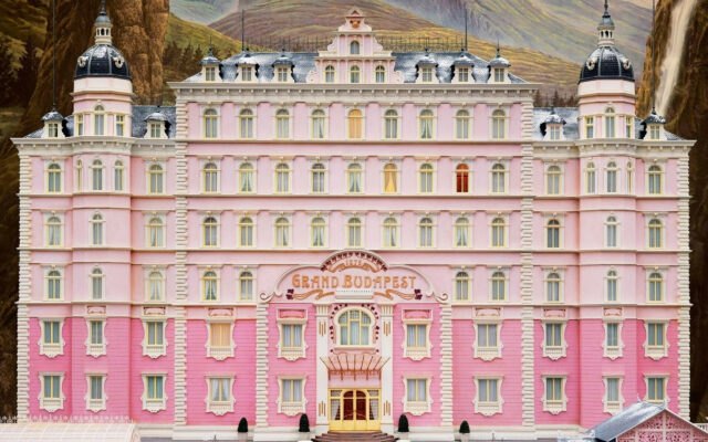 The Grand Budapest Hotel Stunning Pink Facade Wallpaper in Mountain Landscape Setting