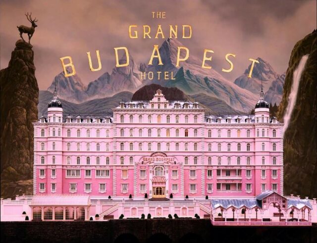 The Grand Budapest Hotel Stunning Pink Facade Wallpaper with Mountain and Waterfall Background