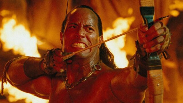 The Scorpion King Hero With Bow And Arrow In Battle Scene Wallpaper