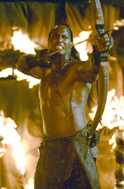 The Scorpion King Hero With Bow And Arrow In Fiery Battle Scene